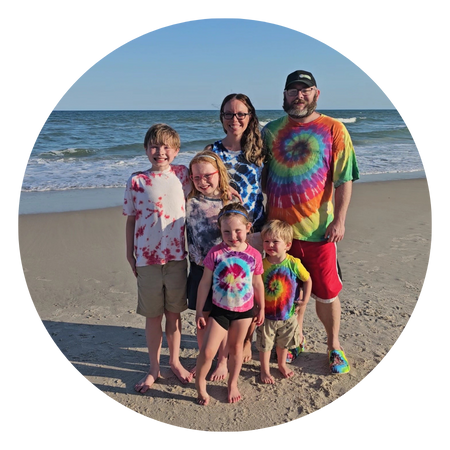 Jessica, Judd, and their four children on the beach
