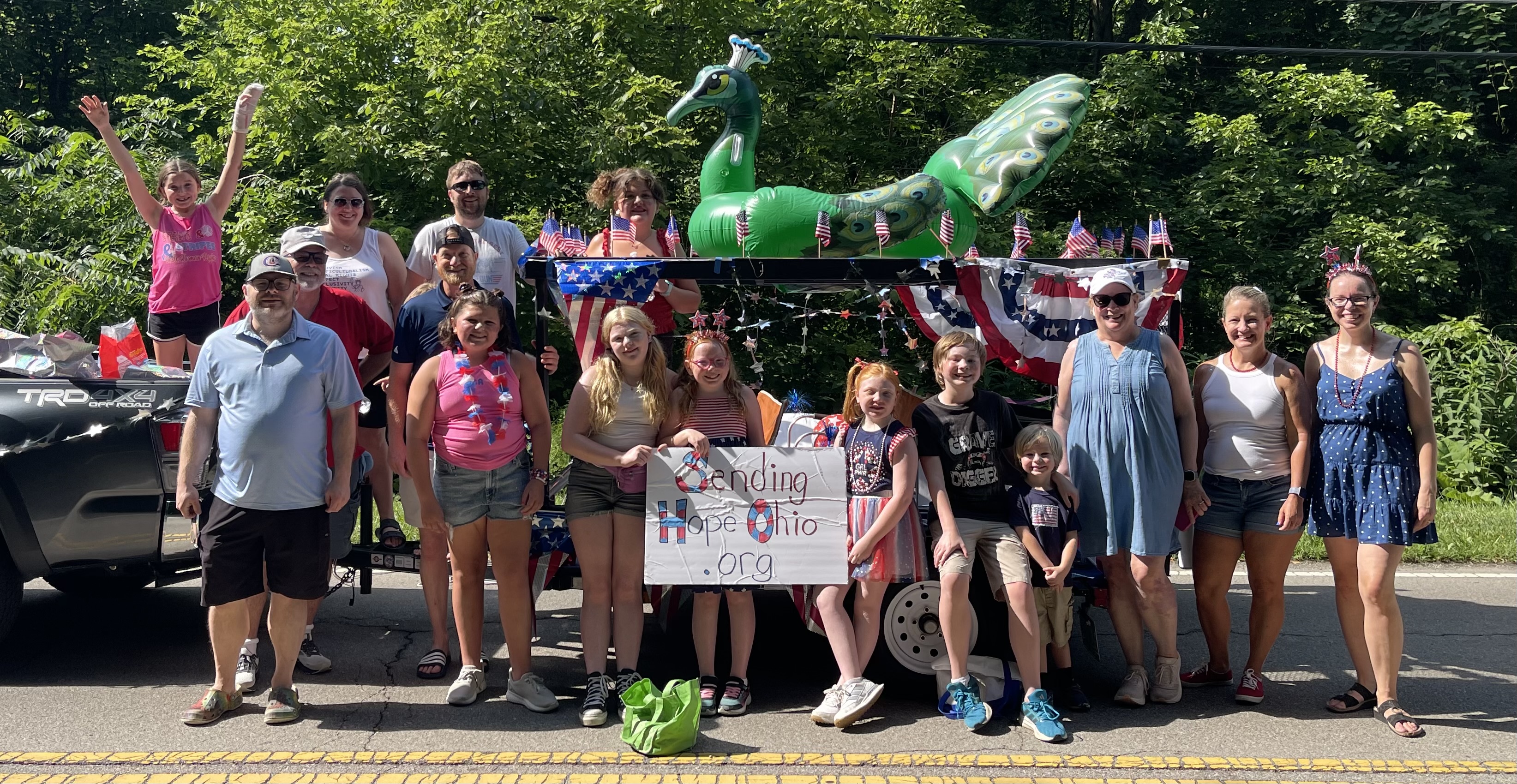 Sending Hope Ohio volunteers and families with their patriotic float at the Granville Fourth of July Parade